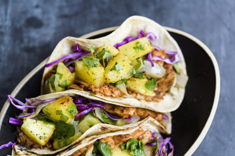 Broiled pork tenderloin tenderized with fresh  pineapple makes tacos al pastor a weeknight affair